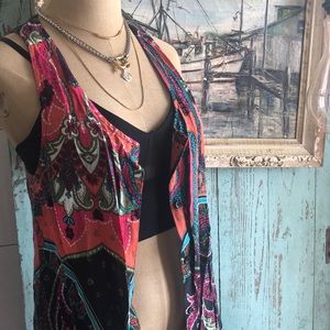 Boho multi colored button down vest.